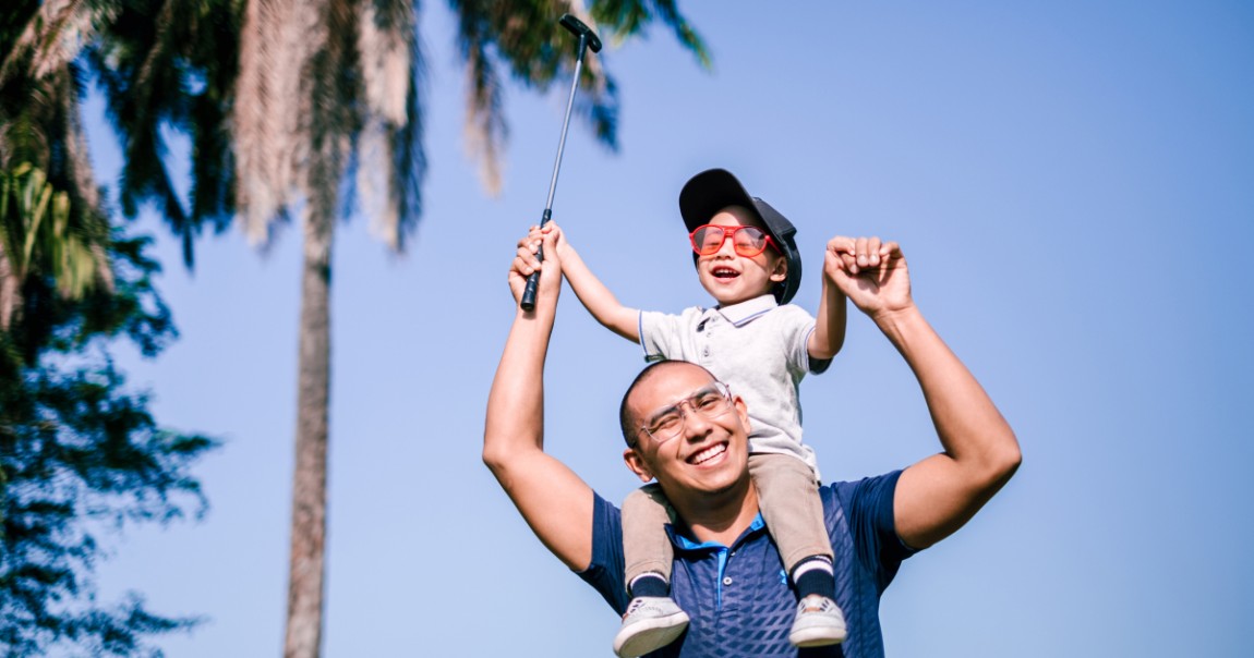 Father and son at golf course