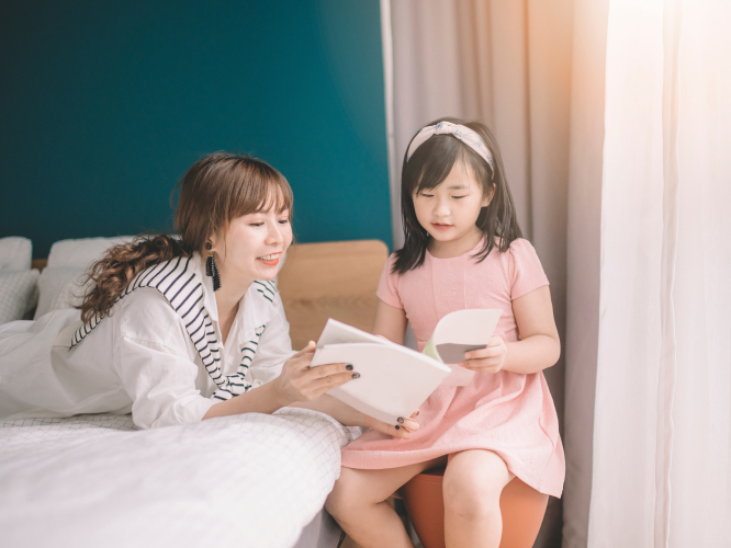 Mother reading to daughter