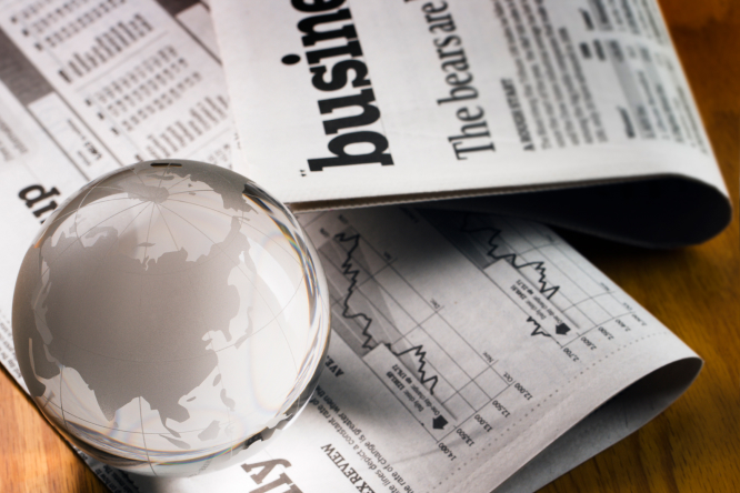 Newspaper with magnifying glass