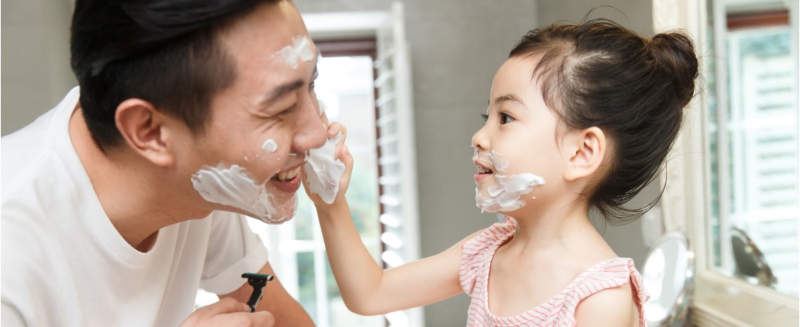 Father and daughter washing hands